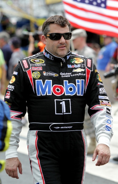 Grumpy Tony Stewart: a lot on his plate. Was the Dover win some Big Mo?